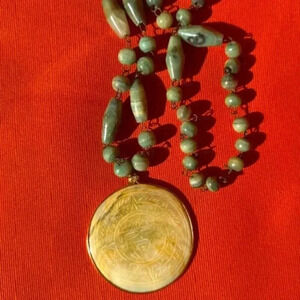 vintage inca carved sun god necklace